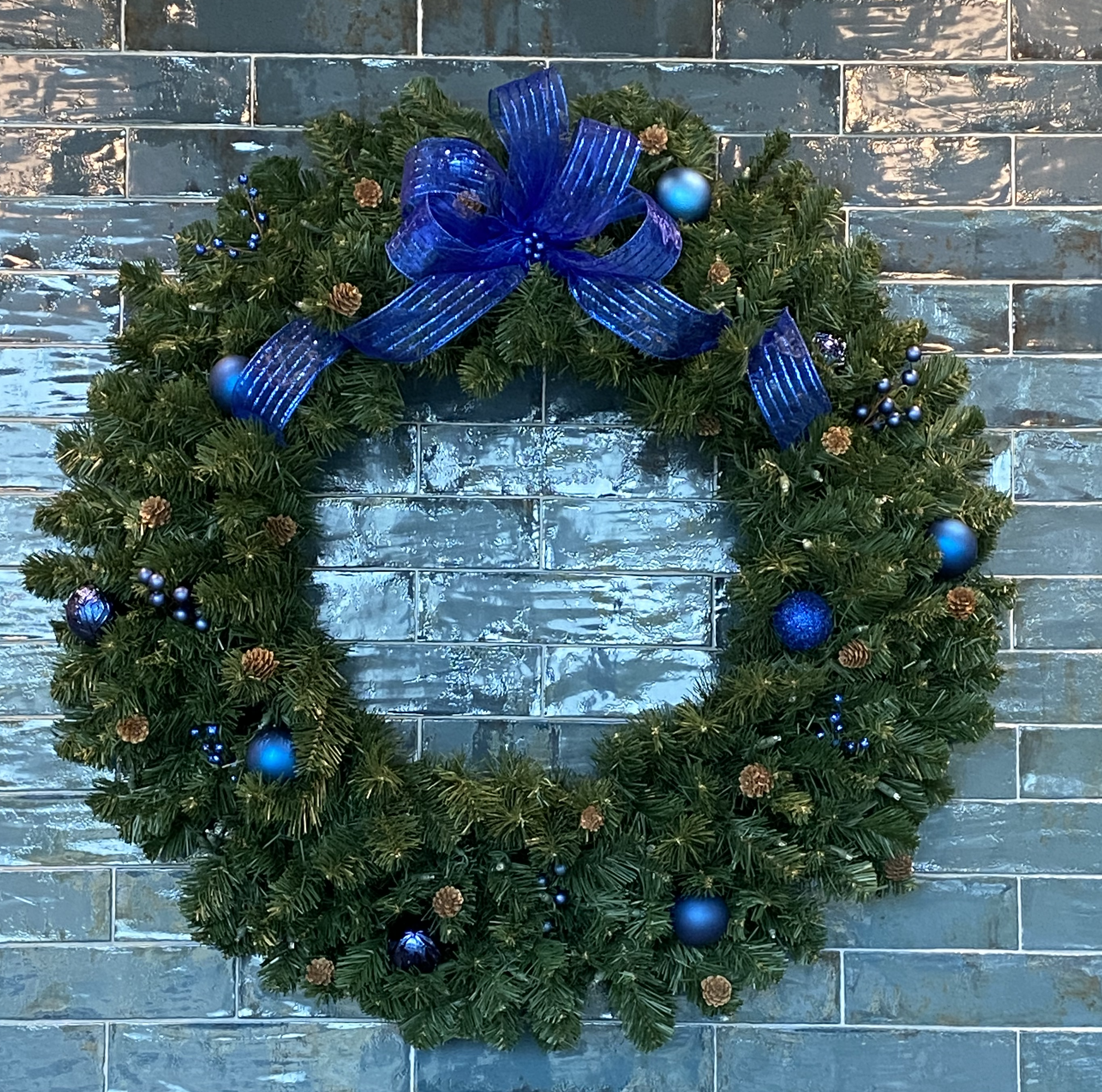 Lighted wreath on wood door