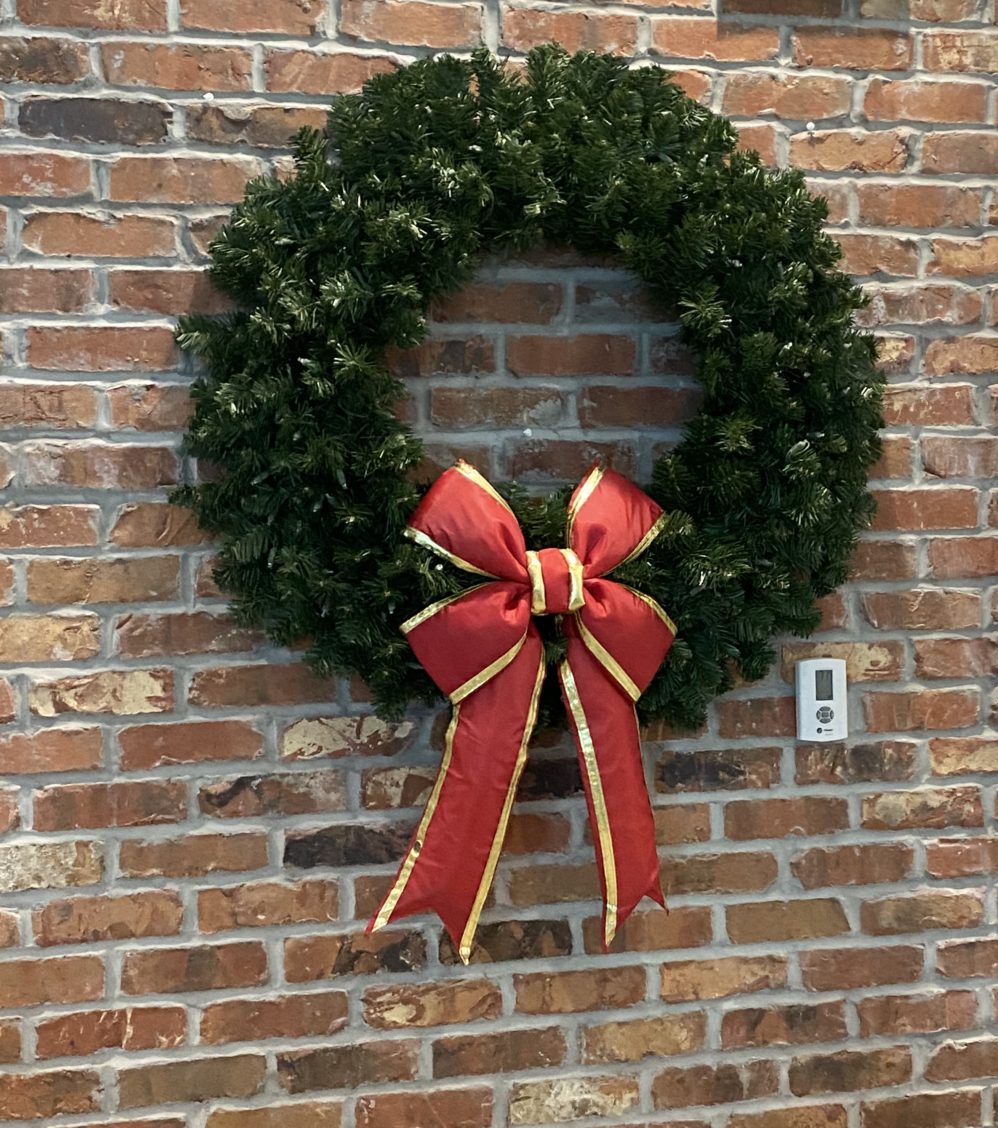 Lighted wreath on wood door